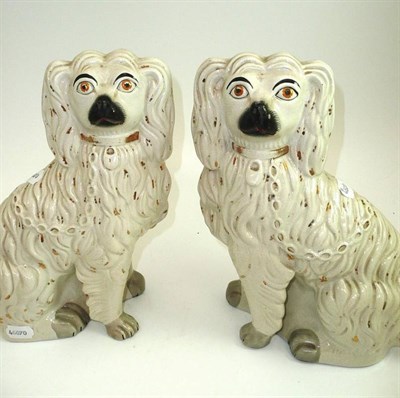 Lot 519 - # A pair of Staffordshire Pottery spaniels, late 19th century, with gilt collars, padlocks and...