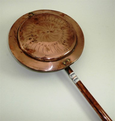 Lot 527 - An 18th century copper warming pan with copper handle