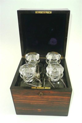 Lot 542 - # A 19th century Coromandel decanter box, of square form, the hinged cover opening to reveal...