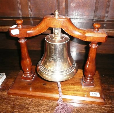 Lot 548 - # A brass bell, bearing inscription METAL FROM HMS TIGER JUTLAND 1916, in wooden frame, 34cm...