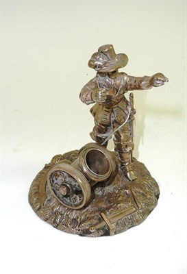 Lot 550 - A 19th century metal figure of a soldier and cannon