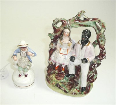 Lot 551 - A 19th century Staffordshire figure group Uncle Tom and another Staffordshire figure (2)