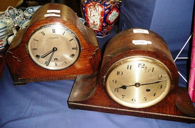 Lot 552 - Two oak dome cased clocks (and a bed warmer)