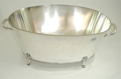 Lot 559 - A large oval silver plated champagne bath on four feet