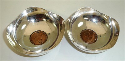 Lot 582 - A pair of silver bowls, each set with a Georgian cartwheel