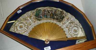 Lot 603 - A gilt framed fan