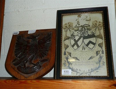 Lot 630 - A carved mahogany eagle shield plaque and an armorial framed picture