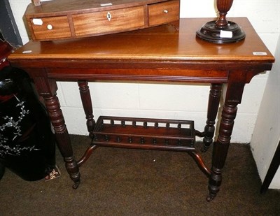 Lot 646 - Victorian walnut fold-over card table