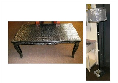 Lot 648 - A silver embossed coffee table and a chrome standard lamp