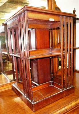 Lot 653 - An Edwardian mahogany revolving bookcase, with label for Donald and Duncan, Dundee, lacking base