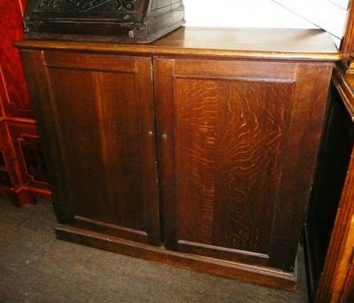 Lot 654 - Late Victorian oak collectors cabinet, the two panelled doors enclosing eighteen narrow,...