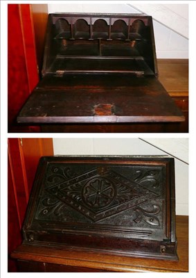 Lot 655 - An 18th century carved oak desktop writing slope