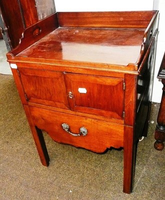 Lot 665 - # George III mahogany beside commode