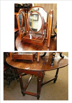 Lot 668 - Early 19th century oak drop leaf table, a mahogany inlaid toilet mirror and walnut triptych mirror