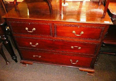 Lot 670 - Mahogany straight fronted chest with blind fret carving