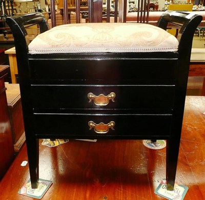 Lot 683 - An ebonised piano stool