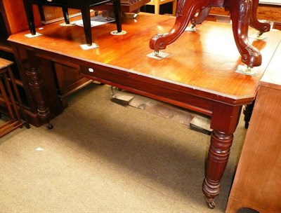 Lot 694 - A Victorian wind-out dining table and an oval loo table