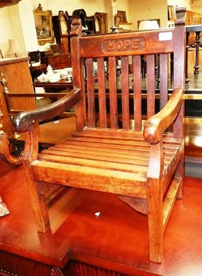 Lot 698 - An early 20th century oak child's chair with ivory makers plaque and named HOPE