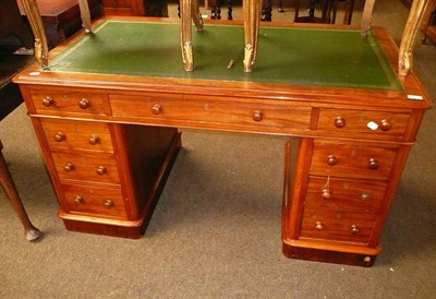 Lot 701 - An early 20th century walnut pedestal desk