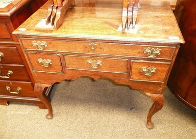 Lot 707 - # A Georgian oak lowboy