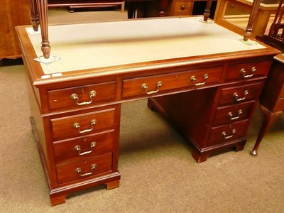 Lot 709 - # Mahogany twin pedestal desk in the George III style with new leather top