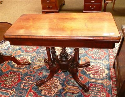 Lot 711 - A Victorian rosewood cluster column fold-over card table