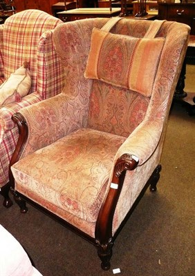 Lot 729 - A Barker and Stonehouse wing armchair with gold upholstery