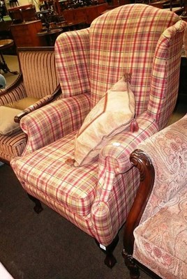 Lot 730 - A Barker and Stonehouse wing armchair with red and gold upholstery