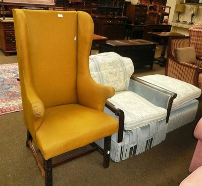 Lot 732 - # Easy chair upholstered in blue floral fabric, a matching footstool and a yellow wing back...