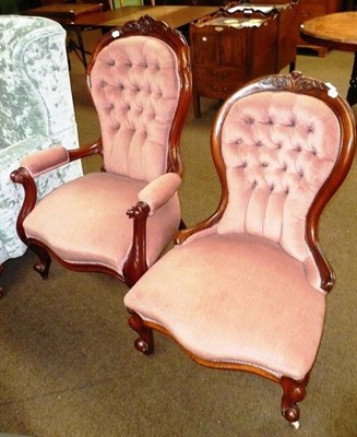 Lot 733 - A Victorian carved mahogany elbow chair with button back and matching nursing chair