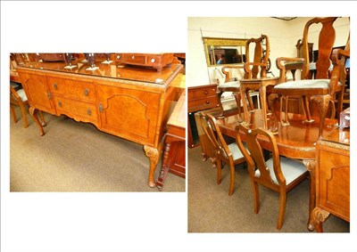 Lot 767 - A walnut dining suite comprising: sideboard, table, six chairs, serving table and a side cupboard