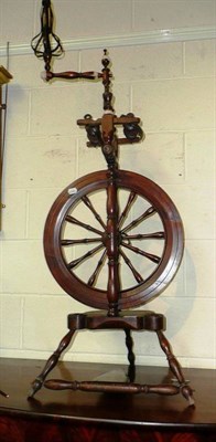 Lot 791 - An early 19th century fruitwood and beech spinning wheel