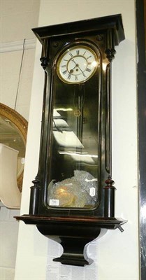 Lot 799 - A 'Vienna' ebonised drop dial wall clock