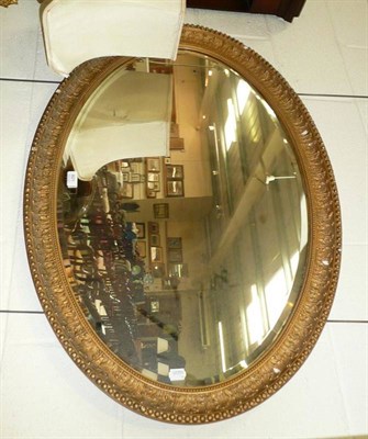 Lot 801 - A oval plaster mirror