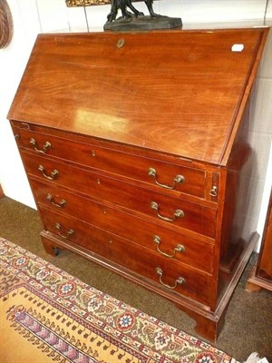 Lot 805 - A George III mahogany bureau with fitted interior