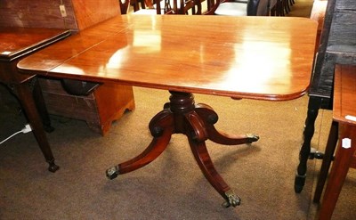 Lot 810 - A Victorian mahogany breakfast table with brass paw feet