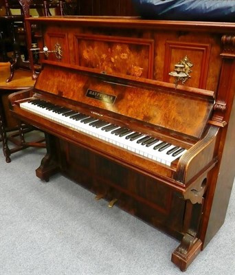 Lot 1022 - A figured walnut upright piano signed Hauptmann, Berlin