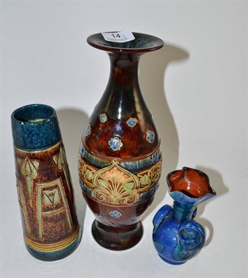 Lot 14 - A Doulton Lambeth stoneware vase with Art Nouveau decoration and a flared neck, and two other vases