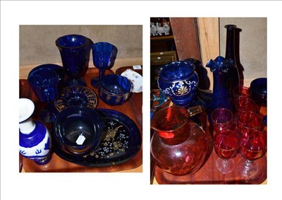 Lot 18 - A quantity of glass, on two trays, including Cranberry glass jug, six wine glasses, two flower...