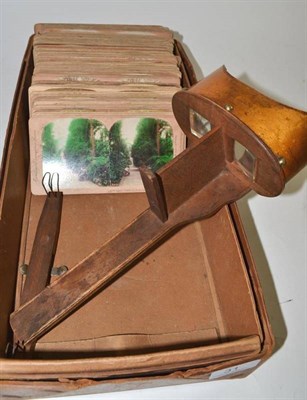 Lot 31 - A stereoscope viewer and slides