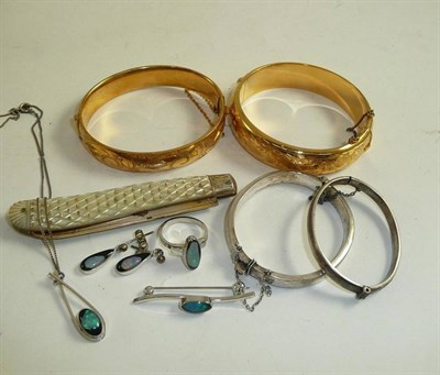 Lot 54 - A silver and mother of pearl fruit knife, two silver babies bangles, two gilt bangles, a pair...