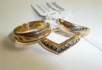 Lot 58 - A 9ct gold diamond set wishbone ring and two 9ct gold rings