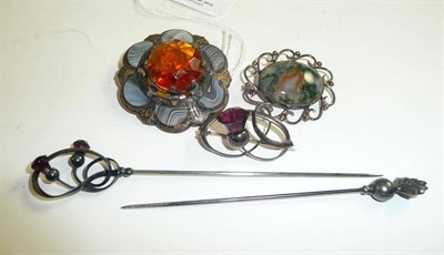 Lot 63 - A Scottish agate brooch, a moss agate brooch, a Charles Horner silver brooch and two Charles Horner