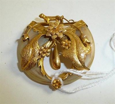 Lot 66 - A double tiger claw brooch with floral design
