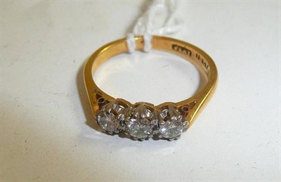 Lot 84 - A diamond three stone ring, stamped 'PLAT' and '18CT', total diamond weight 0.30 carat...