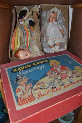 Lot 95 - A Kavin Kupid Supertoys doll's tea set, composition double headed doll, spare head and another doll