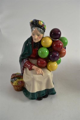 Lot 136 - A Royal Doulton china figure of the Old Balloon Seller HN1315
