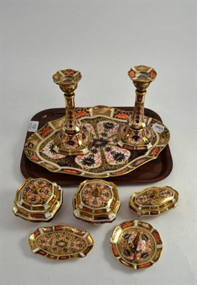 Lot 159 - A Royal Crown Derby six piece dressing table set and a pair of candlesticks (a.f.)