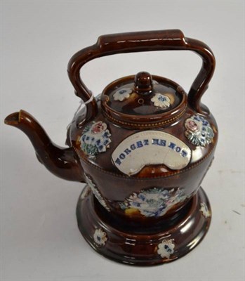 Lot 160 - A Measham 'Forget Me Not' teapot on stand