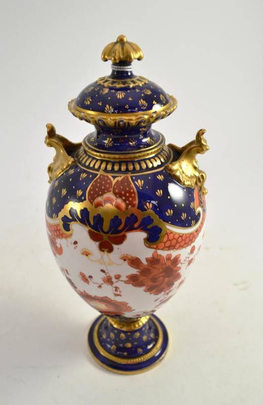 Lot 180 - A Royal Crown Derby floral decorated vase and cover